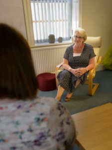 Themed business portrait showing counsellor Jenny Holmes at work.